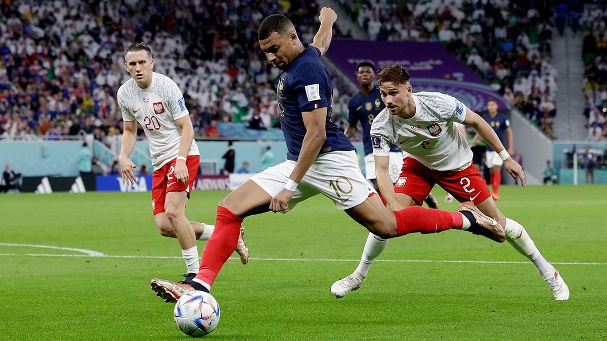 France  v Poland -World Cup DOHA, QATAR - DECEMBER 4:  (L-R) Piotr Zielinski of Poland, Kylian Mbappe of France, Matty Cash of Poland  during the  World Cup match between France  v Poland at the Al Thumama Stadium on December 4, 2022 in Doha Qatar (Photo by Eric Verhoeven/Soccrates/Getty Images)