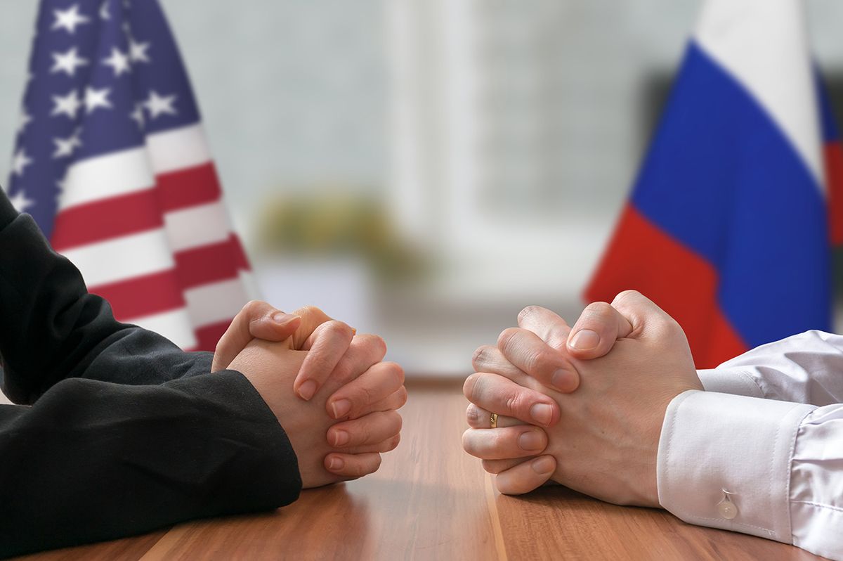 Negotiation of USA and Russia. Statesman or politicians. Negotiation of USA and Russia. Statesman or politicians with clasped hands.
