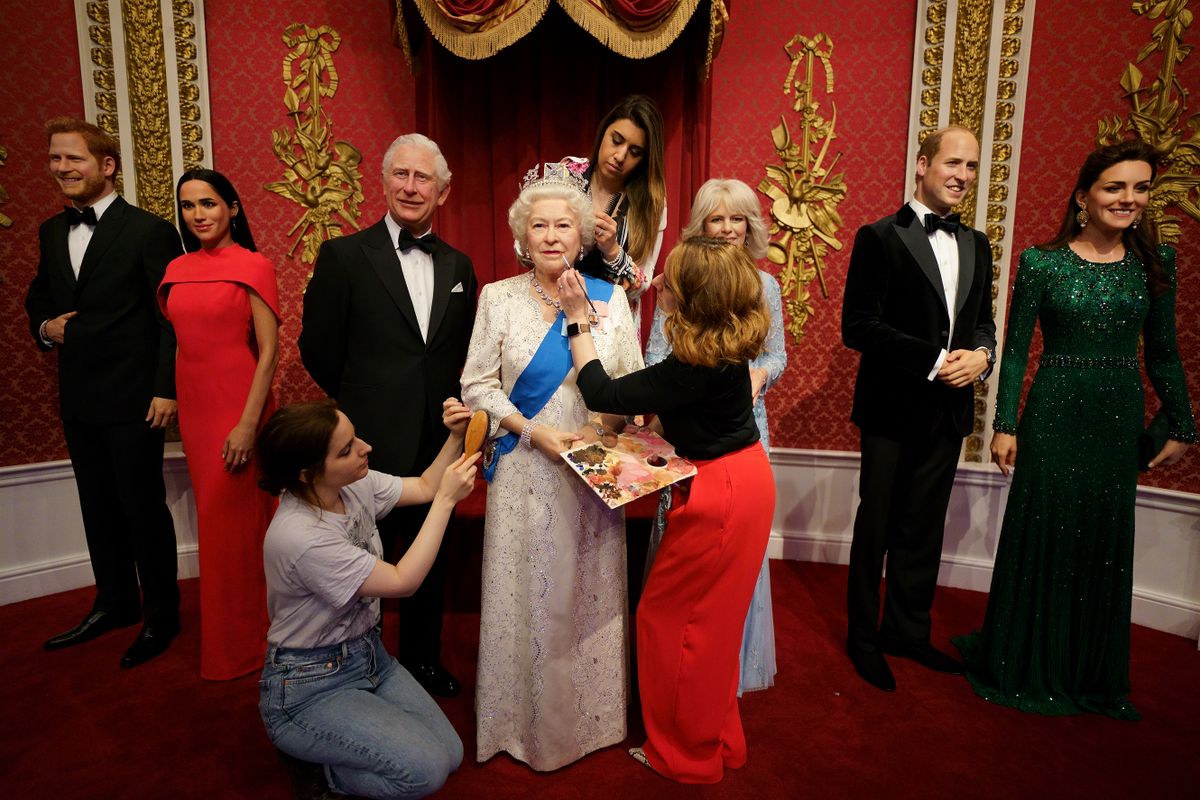 Studio artists Luisa Compobassi (left), Caryn Mitanni (back) and Jo Kinsey (right) make their final touches to the wax figure of Queen Elizabeth II at Madame Tussauds London ahead the Platinum Jubilee celebrations. Picture date: Wednesday May 25, 2022. 