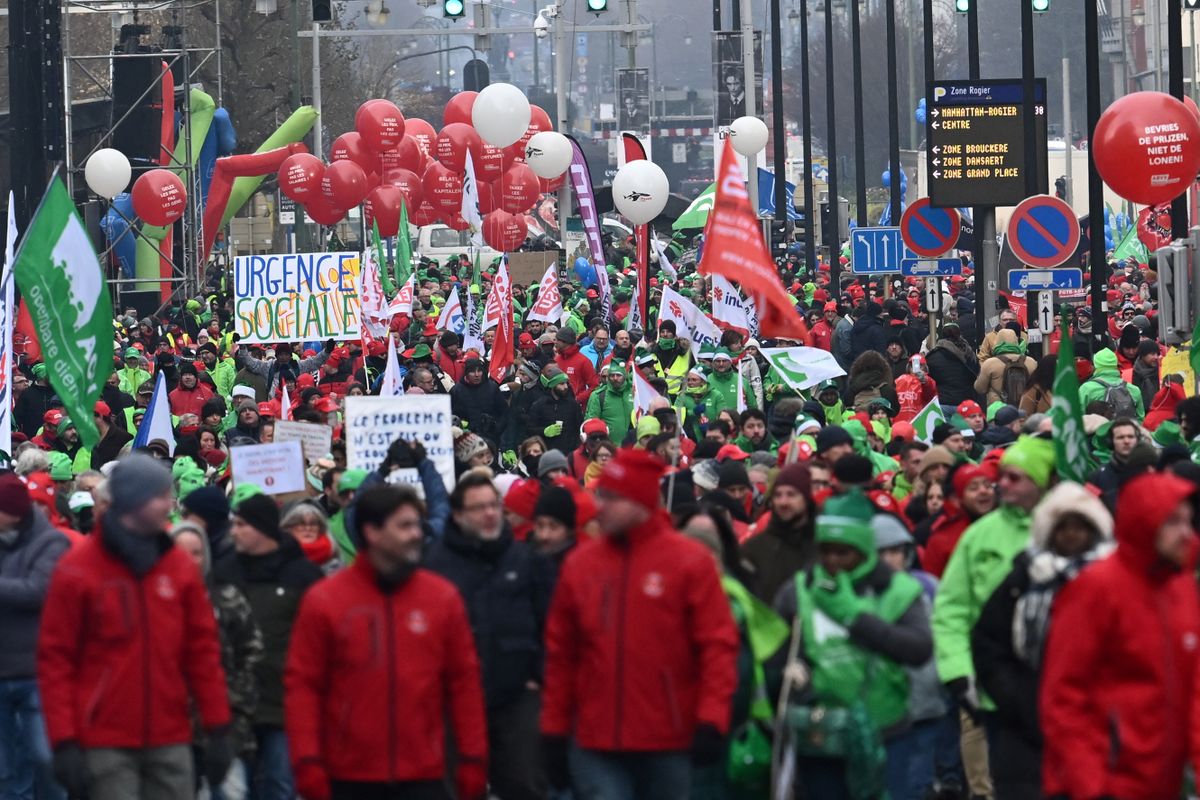 People take part in a nation-wide demonstration organized by the three national trade unions to demand more measures against the rising cost of living, on December 16, 2022 in Brussels. 