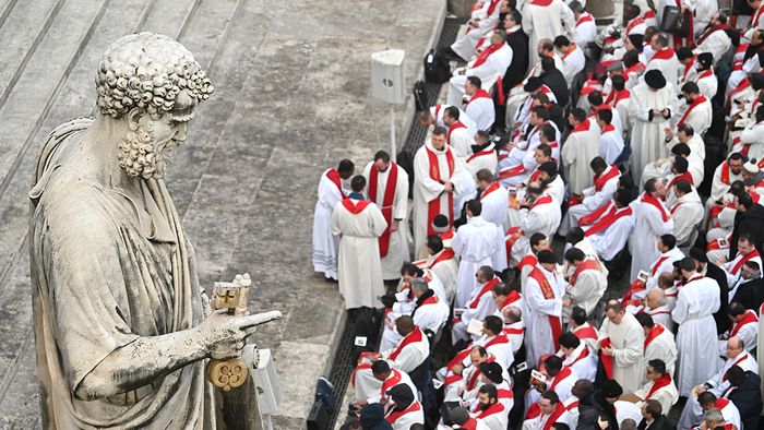 Clergy members attend the funeral mass of Pope Emeritus Benedict XVI at St. Peter's square in the Vatican, on January 5, 2023. (Photo by Alberto PIZZOLI / AFP)
