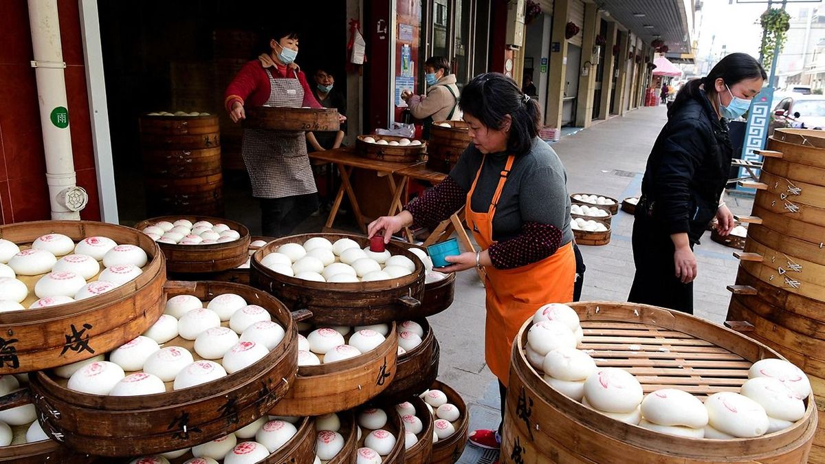 Chinese steamed buns welcome Spring Festival in Jinhua Workers are busy making "red printed steamed buns" in a Chinese steamed bun shop in Yafan Town, Wucheng District, Jinhua City, east China's Zhejiang Province, 11 January, 2023. (Photo by Shi Bufa / ImagineChina / Imaginechina via AFP)