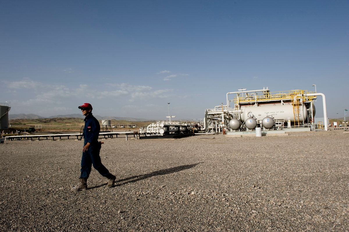 TAWKE, IRAQ: A worker walks through the Tawke oil field in Iraqi Kurdistan. Norwegian oil company DNO is extracting oil in the Kurdish region of Iraq