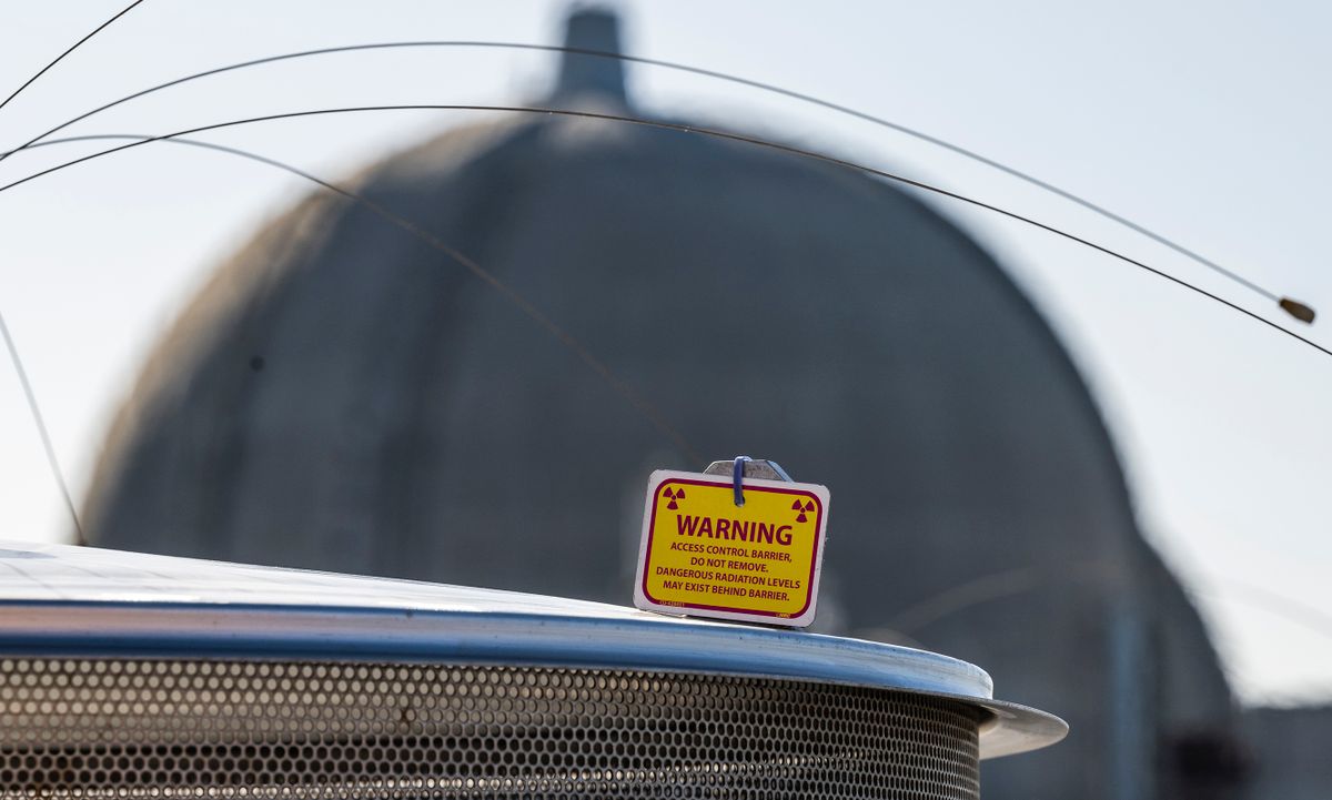 SAN CLEMENTE, CA - April 21: A warning sign sits on top of one of the Holtec HI-STORM UMAX dry storage containers the ISFSI (Independent Spent Fuel Storage Installation) at the shuttered San Onofre Nuclear Generating Station south of San Clemente, CA on Thursday, April 21, 2022. 