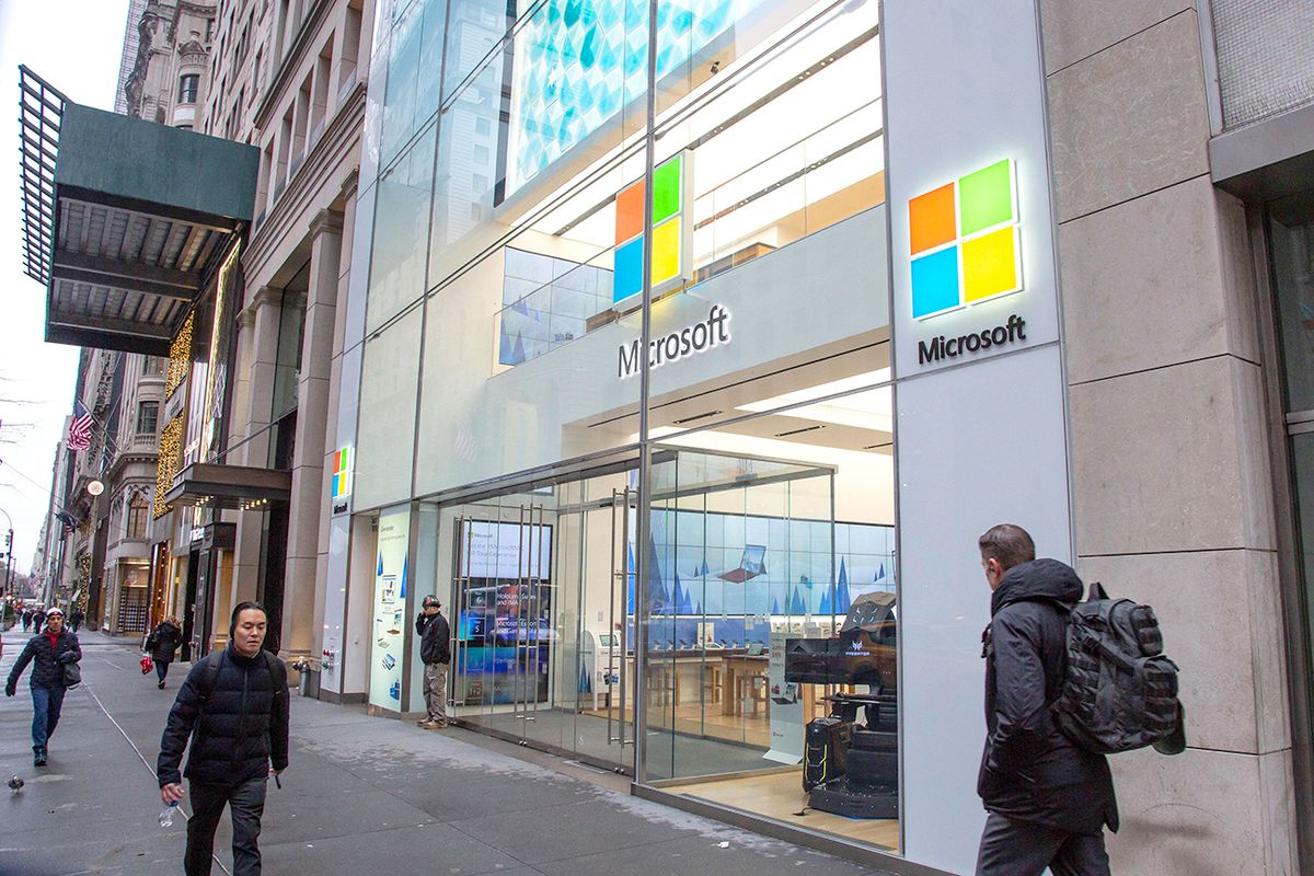 Microsoft Store In New York People walk past a Microsoft store entrance with the company's logo on top in midtown Manhattan at the 5th avenue in New York City, US, on 11 November 2019. Microsoft Corporation is world's largest software maker dominant in PC operating system Microsoft Windows, office applications, web browser and communication market. (Photo by Nicolas Economou/NurPhoto) (Photo by Nicolas Economou / NurPhoto / NurPhoto via AFP)
