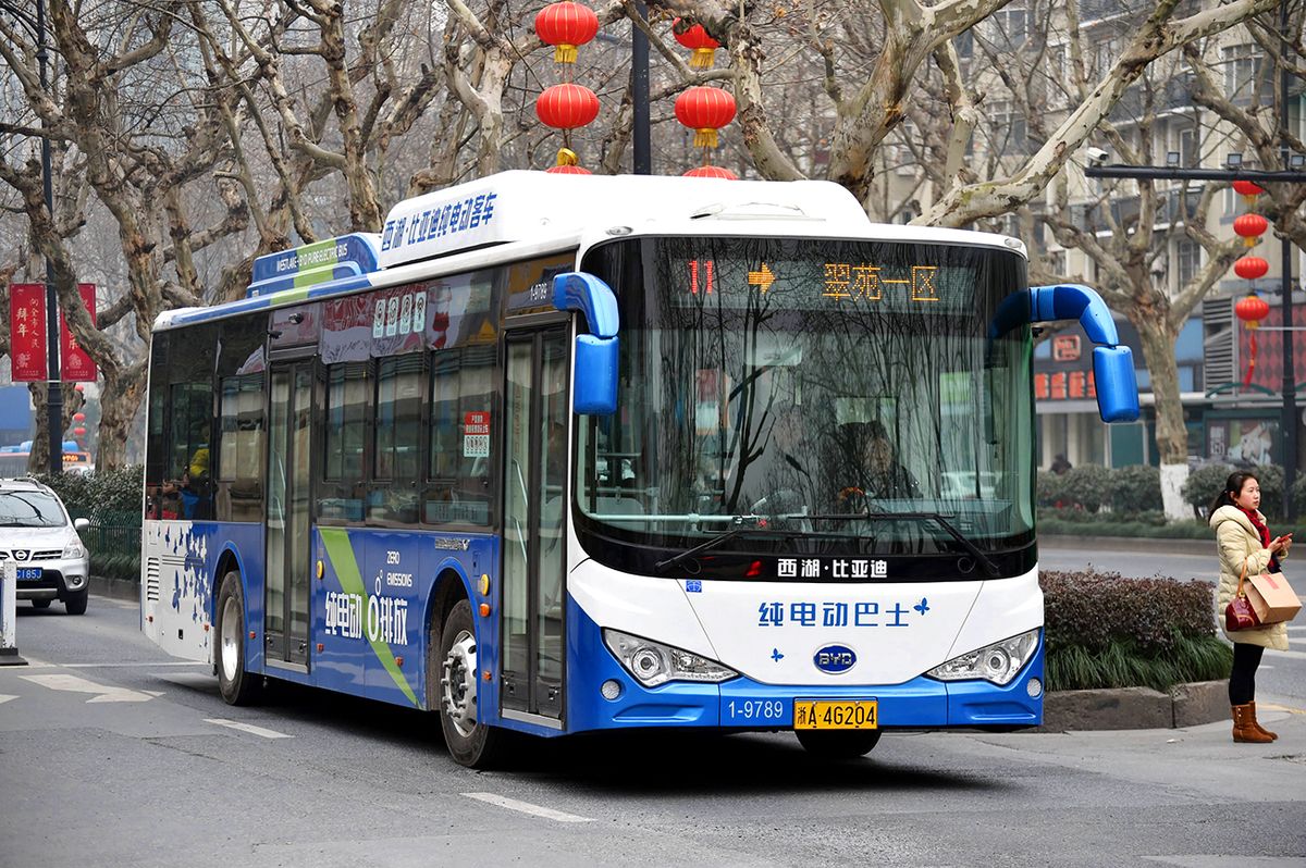 Shenzhen cancels 1.8 billion yuan deal for BYD electric buses --FILE--An electric bus of BYD travels on the road in Hangzhou ctiy, east China's Zhejiang province, 4 February 2016.Mainland electric car manufacturer BYD said the bulk of a 1.8 billion yuan (US$269 million) deal that it only just won from a Shenzhen government-owned bus operator has been cancelled. The company said in announcements to the Hong Kong and Shenzhen stock exchanges late on Monday (11 July 2016) that Shenzhen Western Bus Co. has terminated a procurement plan for 2,228 10-metre long electric buses from its subsidiary BYD Auto Industry. "Due to capacity adjustment, the procurement plan for 2,919 new energy vehicles (Batch 2) has been changed and the tendering process terminated," the Shenzhen Transportation Research and Design Institute Co, agent for the purchaser, said in an announcement on its website on Monday. BYD announced on July 7 that it was the first-ranked winning bidder for the tender worth 1,797 million yuan, excluding national and municipal government allowances. The tender, comprising three batches, included 296 8-metre long electric buses, 2,228 10-metre long electric buses and 395 10-metre long electric buses. (Photo by Zhejiang Daily / Imaginechina / Imaginechina via AFP)