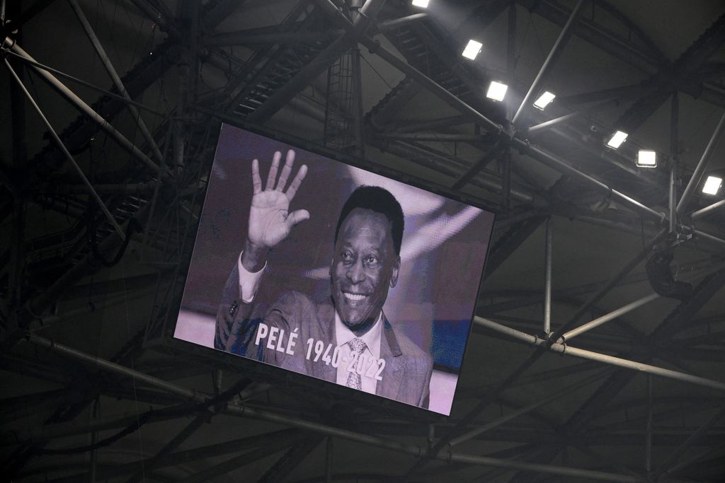 A photograph of Brazilian football legend Pele is displayed on a giant screen prior to the French L1 football match between Olympique de Marseille and Toulouse FC at the Velodrome stadium in Marseille on December 29, 2022. - Football legend Pele died on December 29, 2022 at the age of 82. 