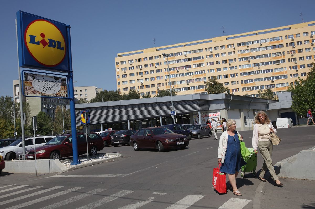 BUCHAREST, ROMANIA - SEPTEMBER 07:  Shoppers emerge from a Lidl discount grocery store on September 7, 2013 in Bucharest, Romania. While Romania's economic output has risen significantly since it joined the European Union in 2007, it still lags in infrastructure development and the fight against corruption. 