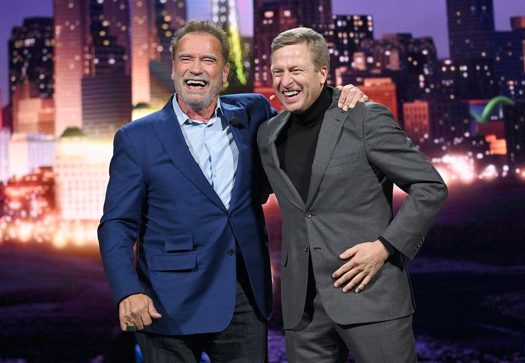 Consumer Electronics Show (CES) 2023 US-Austrian actor and Former Governor of California Arnold Schwarzenegger (L) and Oliver Zipse, Chairman of the Board of Management of BMW, stand on stage during the Consumer Electronics Show (CES) on January 4, 2023 in Las Vegas, Nevada. (Photo by Patrick T. Fallon / AFP)