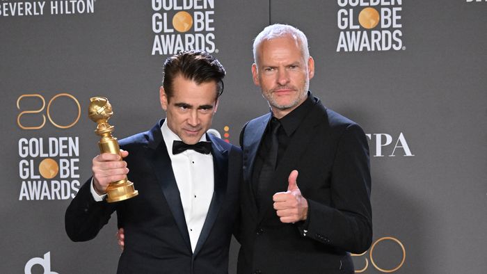 Irish actor Colin Farrell (L) and British-Irish director Martin McDonagh pose with the award for Best Musical/Comedy Series for "The Banshees of Inisherin" in the press room during the 80th annual Golden Globe Awards at The Beverly Hilton hotel in Beverly Hills, California, on January 10, 2023. 