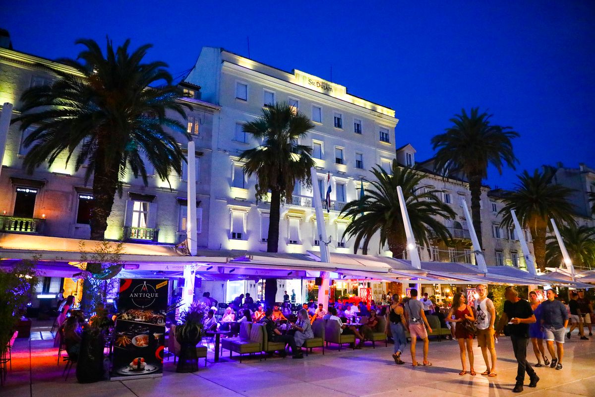 Palm trees at the Riva Promenade in the evening in Split, Croatia on September 14, 2021.