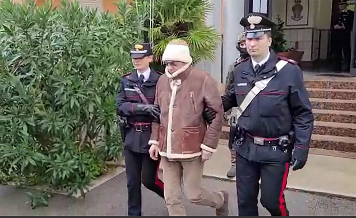 This handout video grab taken and released by the Italian Carabinieri Press Office on January 16, 2023 shows the arrest by Carabinieri of the Italy's top wanted mafia boss, Matteo Messina Denaro in Palermo, in his native Sicily after 30 years on the run. - Italian anti-mafia police caught Sicilian godfather Matteo Messina Denaro on January 16, 2023, ending a 30-year manhunt for Italy's most wanted fugitive. The mobster was nabbed "inside a health facility in Palermo, where he had gone for therapeutic treatment", special operations commander Pasquale Angelosanto said in a statement released by the police.
