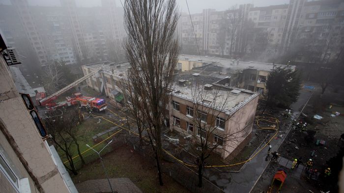 Ukraine Helicopter Crash Near Kindergarten Kills Ministry Leadership BROVARY, UKRAINE - JANUARY 18: Firefighters gather at the site of a helicopter crash on January 18, 2023 in Brovary, Ukraine. Eighteen people have been killed, including Ukraine's interior affairs minister Denys Monastyrsky along with eight other helicopter passengers, after they crashed near a nursery in a Kyiv suburb. (Photo by Yan Dobronosov/Global Images Ukraine via Getty Images)