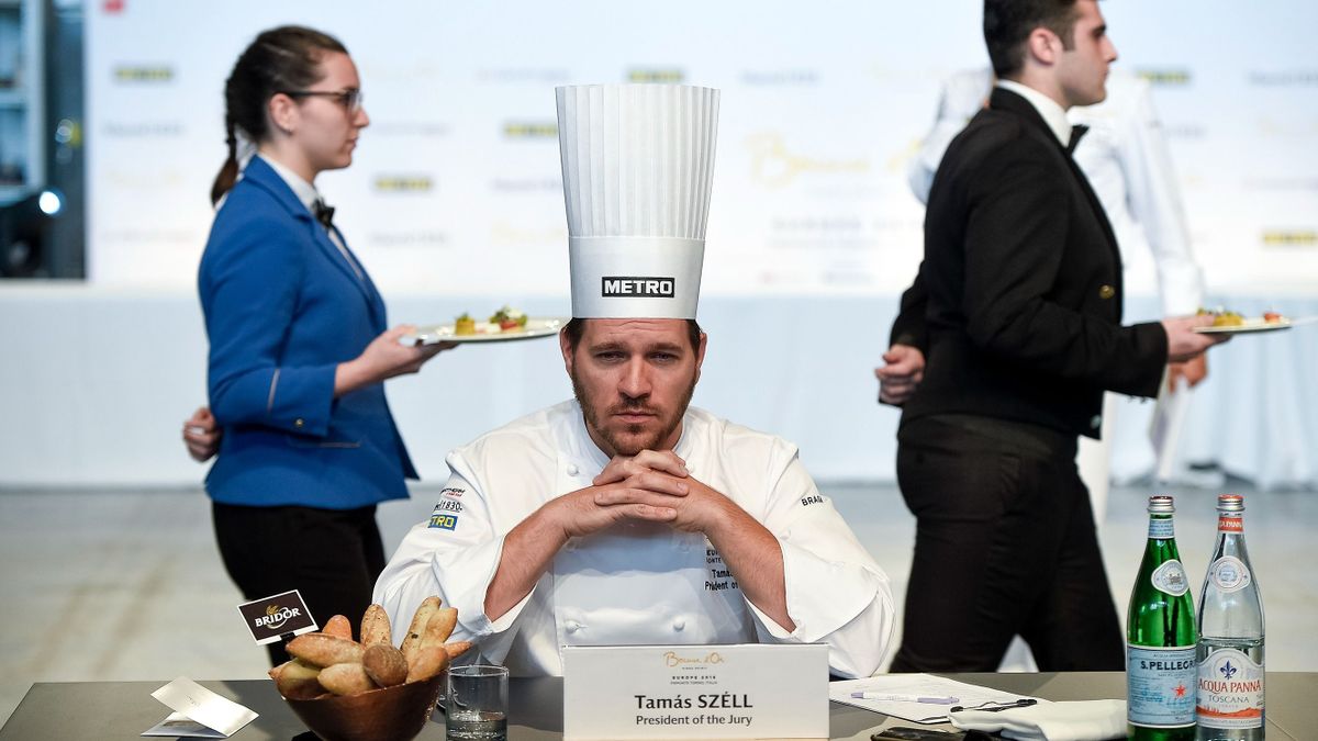 OVAL LINGOTTO, TURIN, ITALY - 2018/06/12: President of jury Tamas Szell (C) looks on during the Europe 2018 Bocuse d'Or International culinary competition. Best ten teams will access to the world final in Lyon in 2019. 