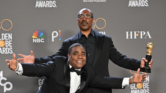 US actor Eddie Murphy (R) poses with the Cecil B. DeMille award alongside US comedian Tracy Morgan in the press room during the 80th annual Golden Globe Awards at The Beverly Hilton hotel in Beverly Hills, California, on January 10, 2023. 