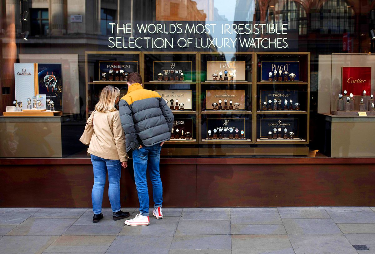 Retail As Britons Start To Feel The Squeeze From Brexit-Fueled Inflation
Pedestrians look at a display of luxury wristwatches in the window of a Watches of Switzerland retail store on Regent Street in London, U.K., on Thursday, Oct. 27, 2016. Multiple reports show consumer confidence falling and a weakening of households spending power likely leading to a jump in inflation, which some economists see reaching 3 percent next year. Photographer: Simon Dawson/Bloomberg via Getty Images