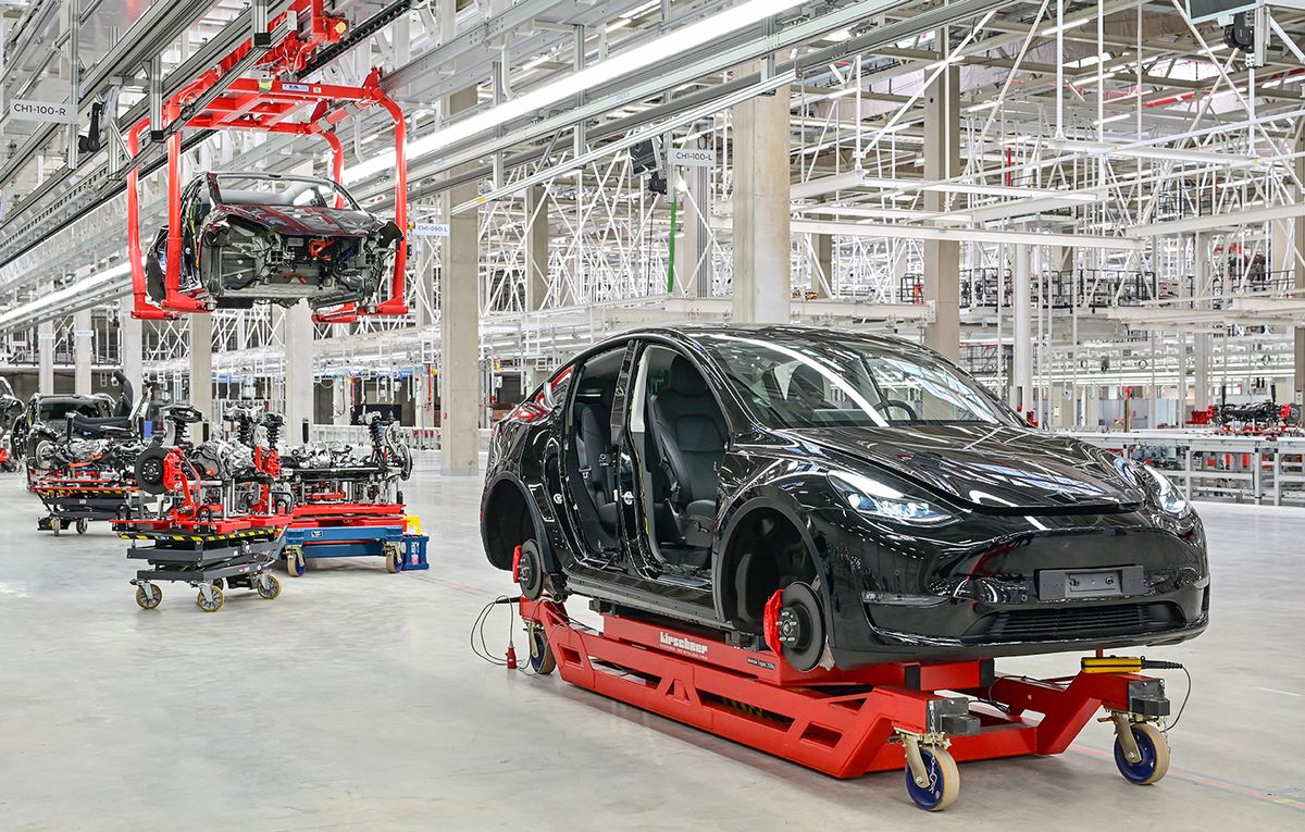 Tesla Gigafactory Berlin Brandenburg 09 October 2021, Brandenburg, Grünheide: A Tesla Model Y is seen in a production hall of the Tesla Gigafactory during the open day. In Grünheide, east of Berlin, the first vehicles are to roll off the production line from the end of 2021. The US company plans to build around 500,000 Model Ys here every year. Photo: Patrick Pleul/dpa-Zentralbild/ZB (Photo by Patrick Pleul/picture alliance via Getty Images)