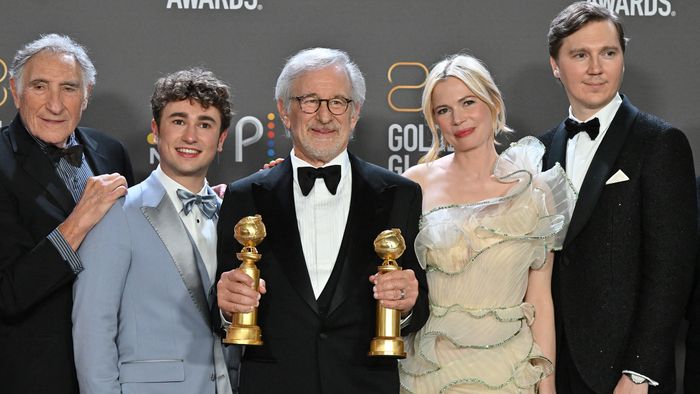 US director Steven Spielberg (C) poses with the awards for Best Director - Motion Picture and Best Picture - Drama for "The Fabelmans" alongside US actor Judd Hirsch (L), Canadian-US actor Gabriel LaBelle (2nd L), US actress Michelle Williams (2nd R) and US actor Paul Dano (R) in the press room during the 80th annual Golden Globe Awards at The Beverly Hilton hotel in Beverly Hills, California, on January 10, 2023. 