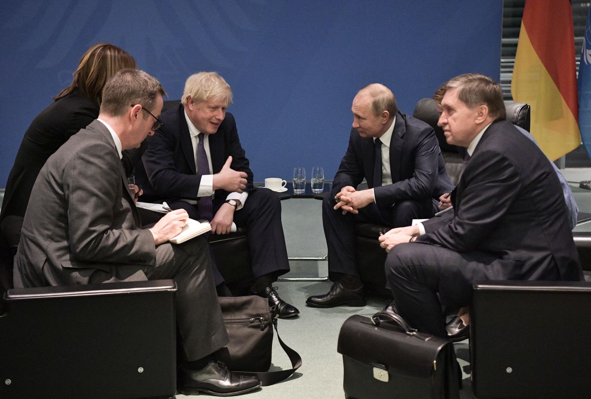 Britain's Prime Minister Boris Johnson and Russian President Vladimir Putin meet on the sidelides of a Peace summit on Libya in Berlin on January 19, 2020.)