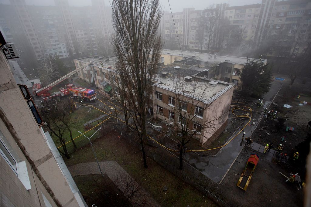 Ukraine Helicopter Crash Near Kindergarten Kills Ministry Leadership BROVARY, UKRAINE - JANUARY 18: Firefighters gather at the site of a helicopter crash on January 18, 2023 in Brovary, Ukraine. Eighteen people have been killed, including Ukraine's interior affairs minister Denys Monastyrsky along with eight other helicopter passengers, after they crashed near a nursery in a Kyiv suburb. (Photo by Yan Dobronosov/Global Images Ukraine via Getty Images)