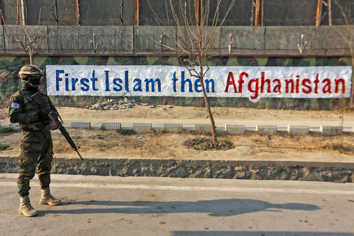 A Taliban fighter stands guard along a street in Kabul on December 27, 2022