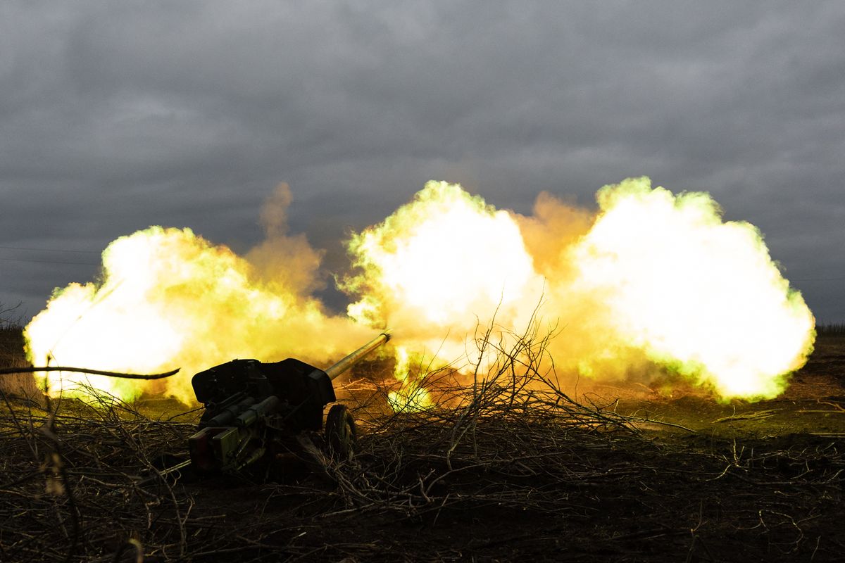 Ukrainian servicemen of an artillery unit fire towards Russian positions on the outskirts of Bakhmut, eastern Ukraine on December 30, 2022. 
