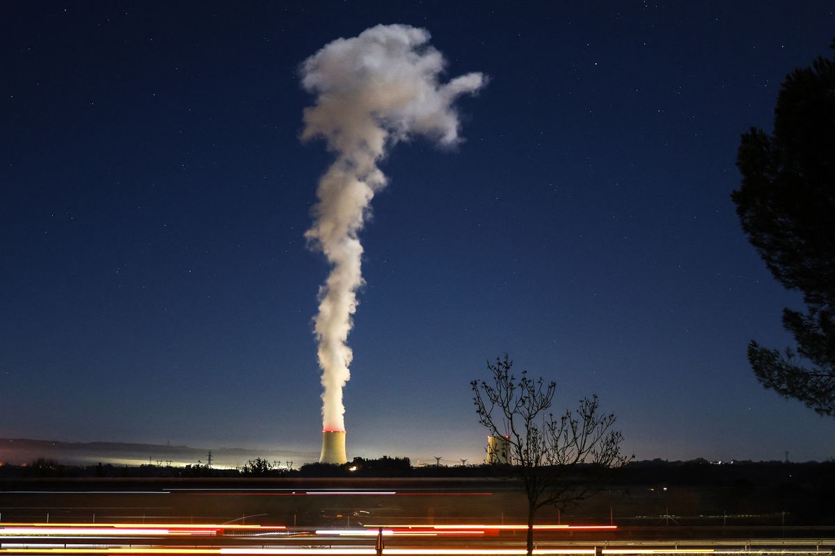A photograph shows the Golfech EDF nuclear plant  at night from Dunes, southwestern France on January 3, 2023. 
