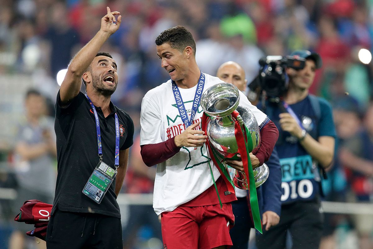 France  v Portugal  -EURO PARIS, FRANCE - JULY 10: (L-R) Ricardo Regufe of Portugal Cristiano Ronaldo of Portugal celebrating with the trophy  during the  EURO match between France  v Portugal  at the Stade de France on July 10, 2016 in Paris France (Photo by Eric Verhoeven/Soccrates/Getty Images)
