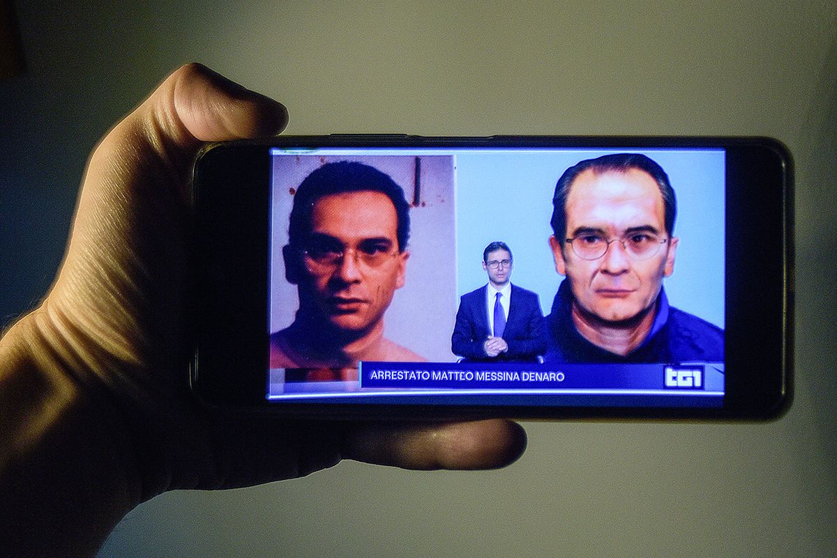 In this photo illustration, a smartphone screen with live ITALY - 2023/01/16: In this photo illustration, a smartphone screen with live news from an Italian television channel about the arrest of fugitive Matteo Messina Denaro. Matteo Messina Denaro considered the head of the Cosa Nostra mafia organization, had been on the run for thirty years and was Italy's number one wanted man. (Photo Illustration by Vincenzo Nuzzolese/SOPA Images/LightRocket via Getty Images)