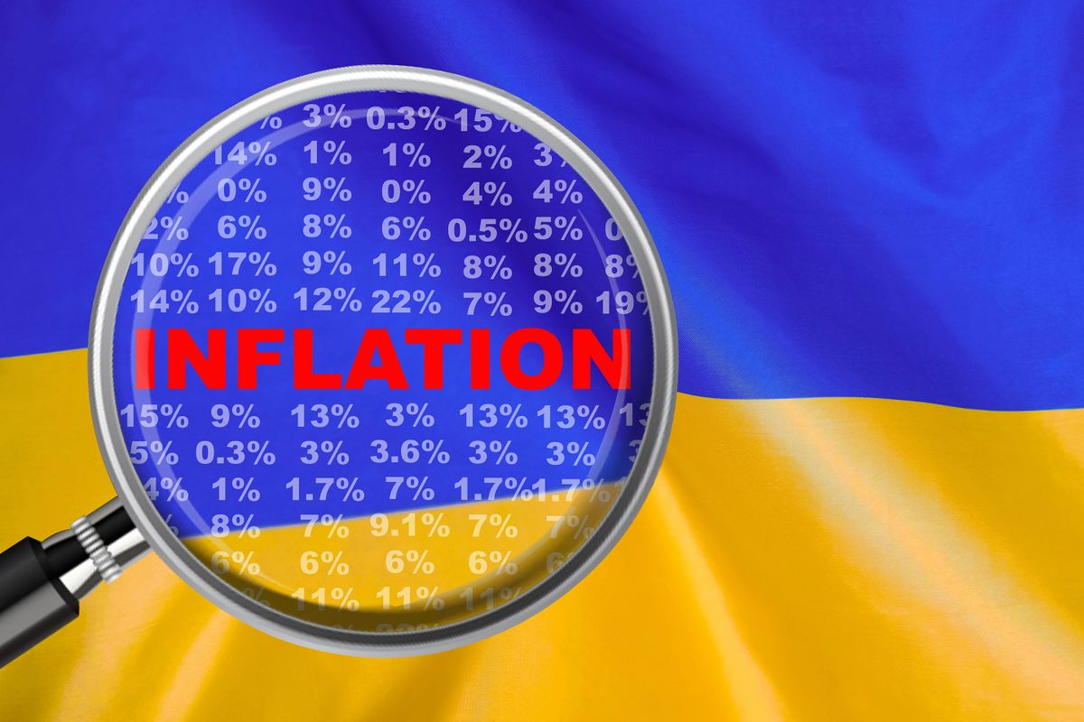 Magnifying,Glass,Focused,On,The,Word,Inflation,On,Ukraine,Flag