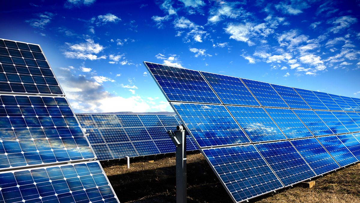 Blue solar panels Photo voltaic solar panels and blue sky with clouds