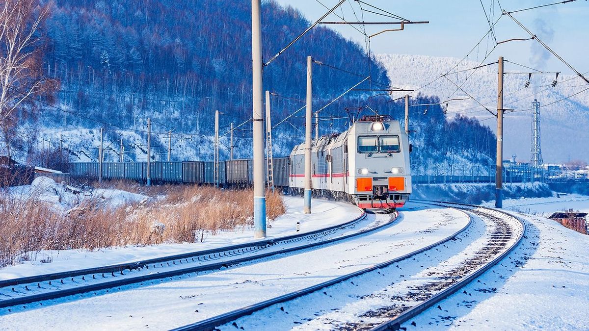 Freight,Train,Moves,Along,Baikal,Lake.,Trans,Siberian,Railway.,Russia. Freight train moves along Baikal lake. Trans Siberian railway. Russia.