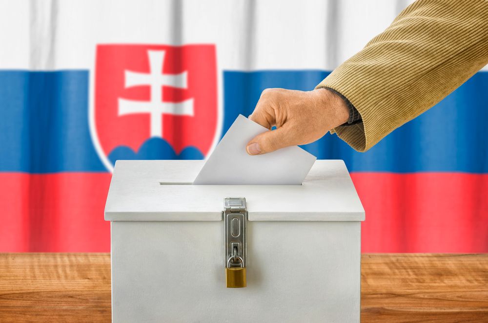 Man,Putting,A,Ballot,Into,A,Voting,Box,-,Slovakia