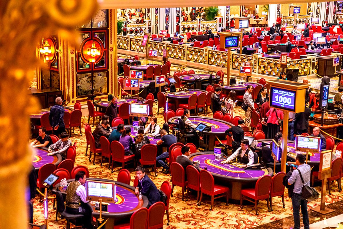 Macau,,China,-,December,9,,2016:,Aerial,View,Of,Blackjack Macau, China - December 9, 2016: aerial view of blackjack tables and gamblers inside The Venetian Casino in Macau. Macau is the capital of casinos and Asian gambling and, now, in the world.