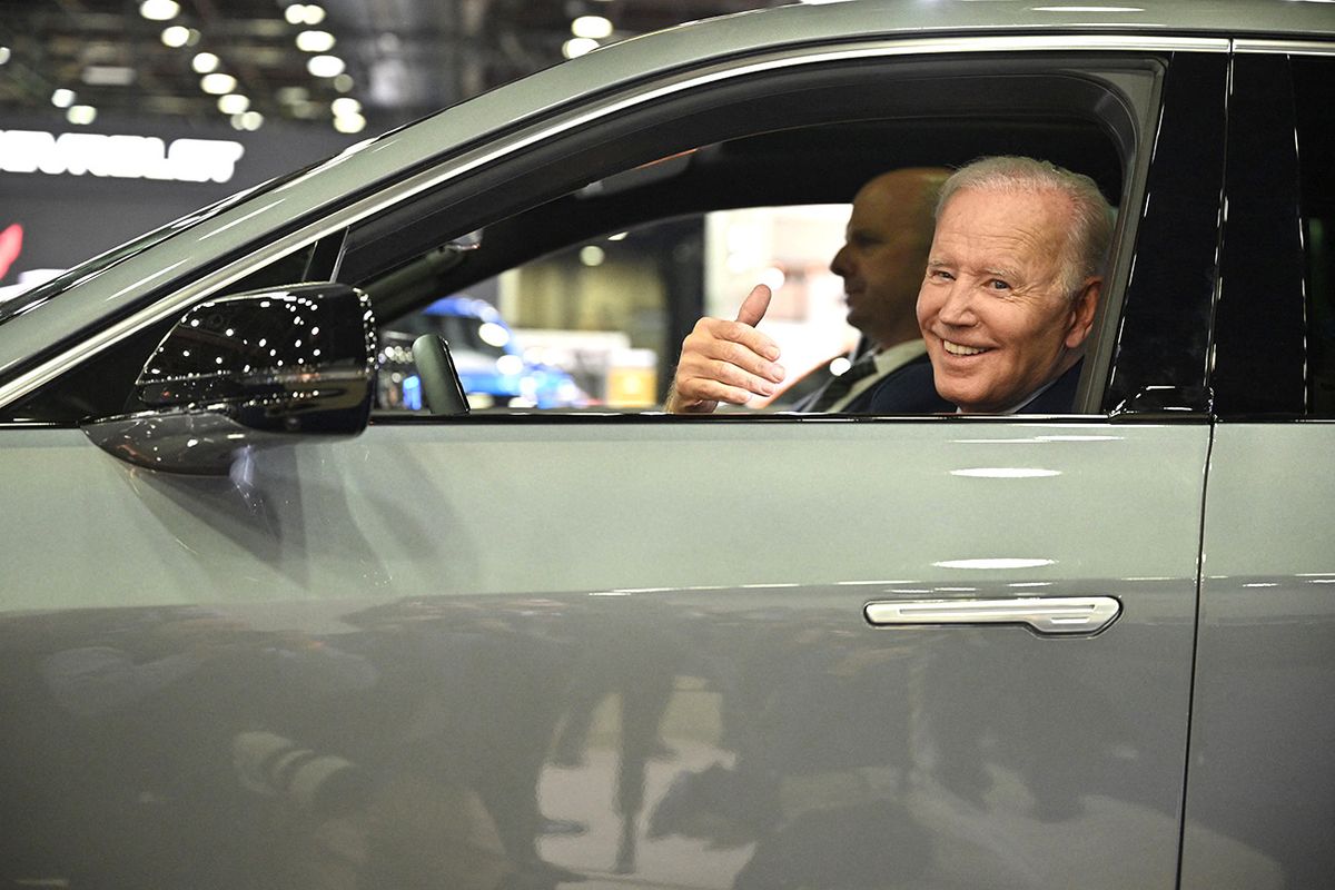 US President Joe Biden sits at the wheel of a Cadillac Lyriq electric vehicle as he visits the 2022 North American International Auto Show in Detroit, Michigan, on September 14, 2022. (Photo by MANDEL NGAN / AFP)