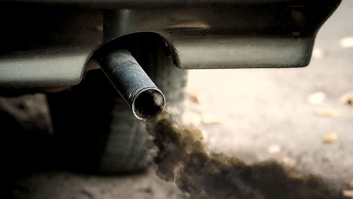 Smoke,From,Old,Dirty,Car,Pipe,Exhaust. Smoke from old dirty car pipe exhaust.