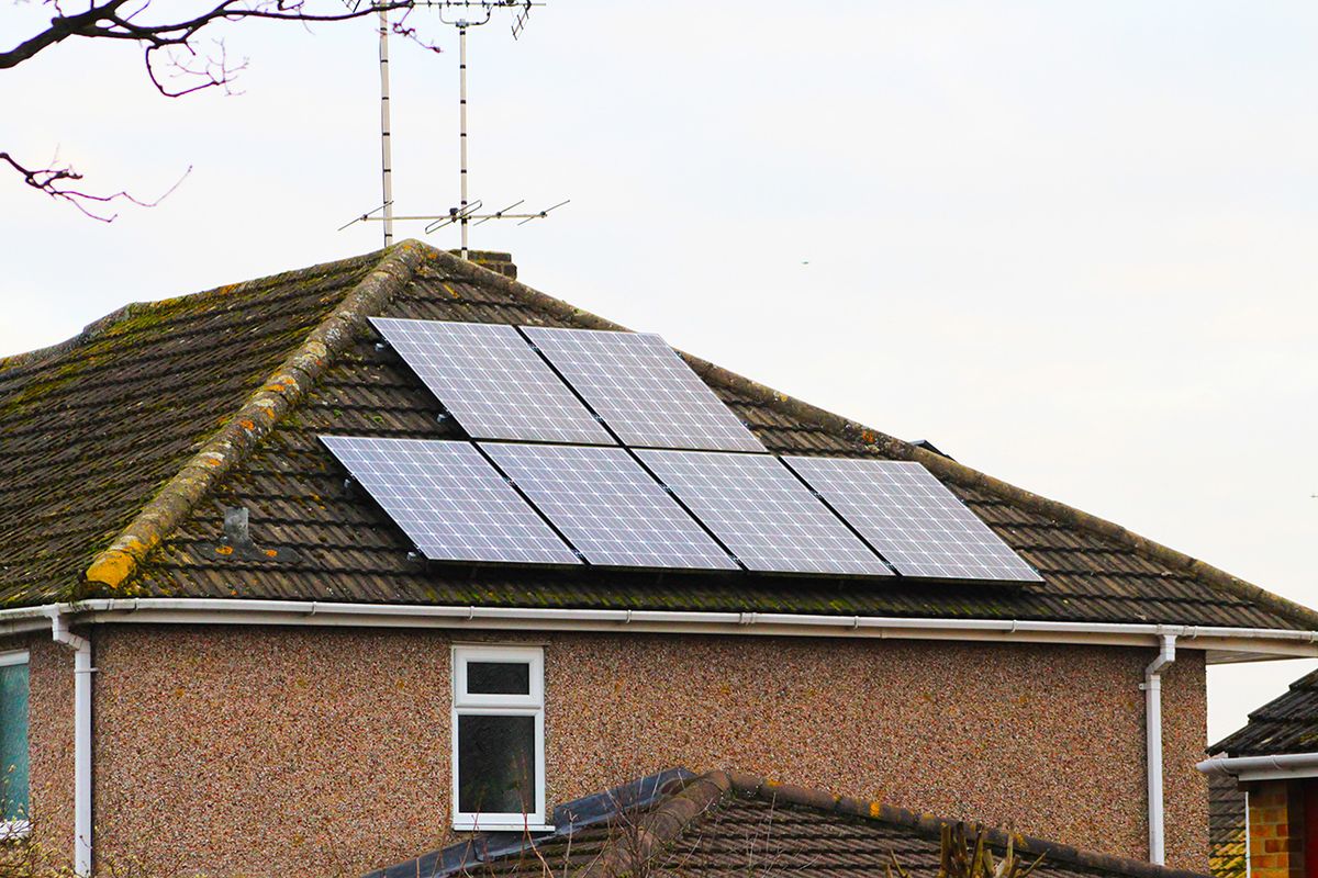 Solar,Panels,On,English,Brick,House,Roof,In,Winter,Season,Solar panels on English brick house roof in winter season, England UK.