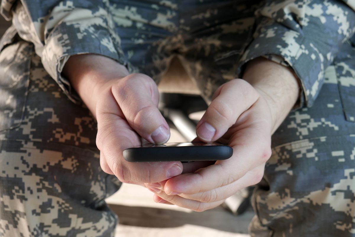 Military,Soldier,Using,Smartphone,For,Texting.,Army,Officer,Typing,Sms