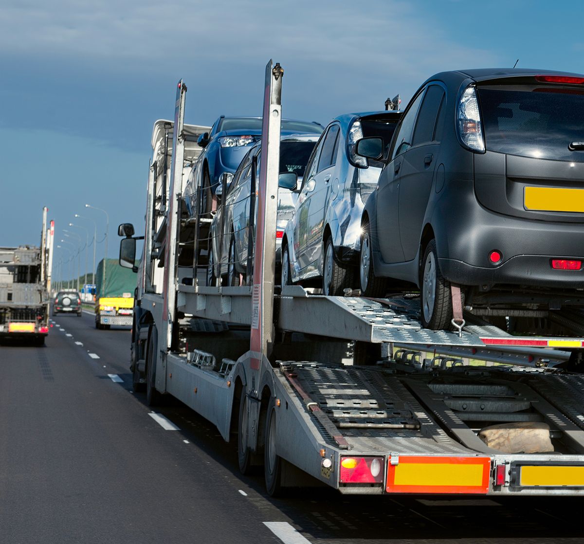 The,Trailer,Transports,Cars,On,The,Highway The trailer transports cars on the highway