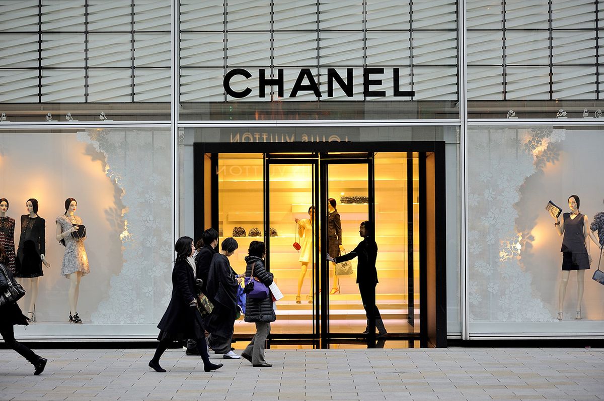 Shoppers Visit The Luxury Brand Stores Shoppers walking past a Chanel store at the high-end shopping district Chanel; brand; brand-name; design; fashion; industry; luxury; store;  