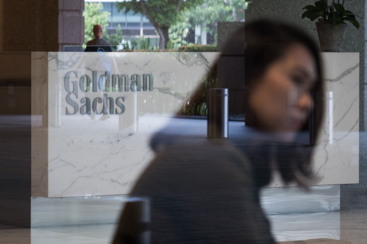 The Goldman Sachs Group Inc. logo is displayed in the reception area of the One Raffles Link building, which houses one of the Goldman Sachs (Singapore) Pte offices, in Singapore, on Saturday, Dec. 22, 2018. Singapore has expanded a criminal probe into fund flows linked to scandal-plagued 1MDB to include Goldman Sachs Group, which helped raise money for the entity, people with knowledge of the matter said