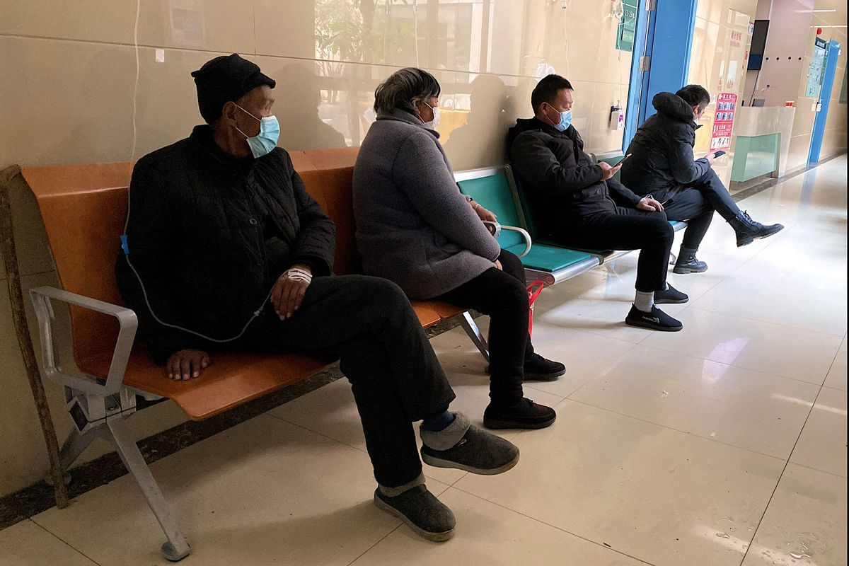 Patients with Covid-19 coronavirus rest in a hallway at Fengyang People's Hospital in Fengyang County in east China's Anhui Province on January 5, 2023.