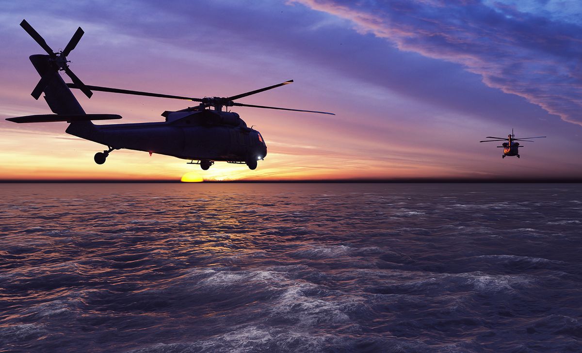 Black,Hawk,Military,Helicopters,Fly,At,Sunrise,Across,The,Boundless Black hawk military helicopters fly at sunrise across the boundless sea. 3D Rendering