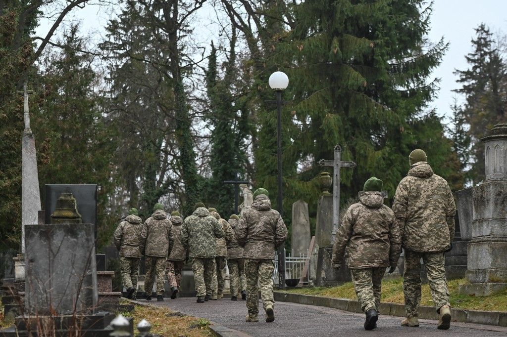Families visit graves of fallen soldiers on Orthodox Christmas Eve in Ukraine's Lviv