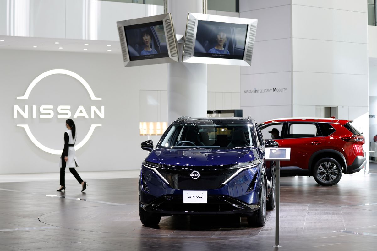 Nissan Motor Co. vehicles on display in a showroom at the company's global headquarters in Yokohama, Japan, on Wednesday, Nov. 9, 2022. Nissan raised its profit outlook as a weak yen boosted repatriated income, helping to compensate for a persistent shortage of chips and supply-chain constraints that have curtailed output in the industry. 