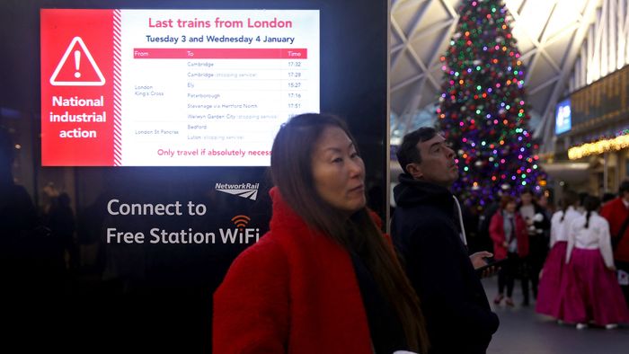 An information screen displays news of the last trains out of London stations, at Kings Cross Station in London, on January 2, 2023, ahead of strike action on National Railways. - Strikes are planned for this week starting on Tuesday January 3, called by the Rail, Maritime and Transport union (RMT). The union says more than 40,000 members across Network Rail and 14 train operating companies will take strike action. In addition, the train drivers union, Aslef has announced strike action for Thursday, January 5.