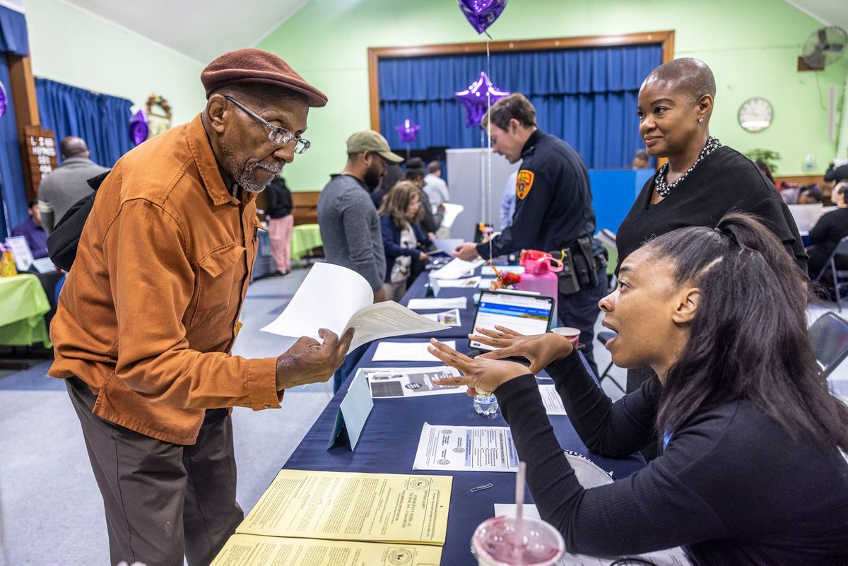Job seekers meet with potential employers at Long Island job fair
