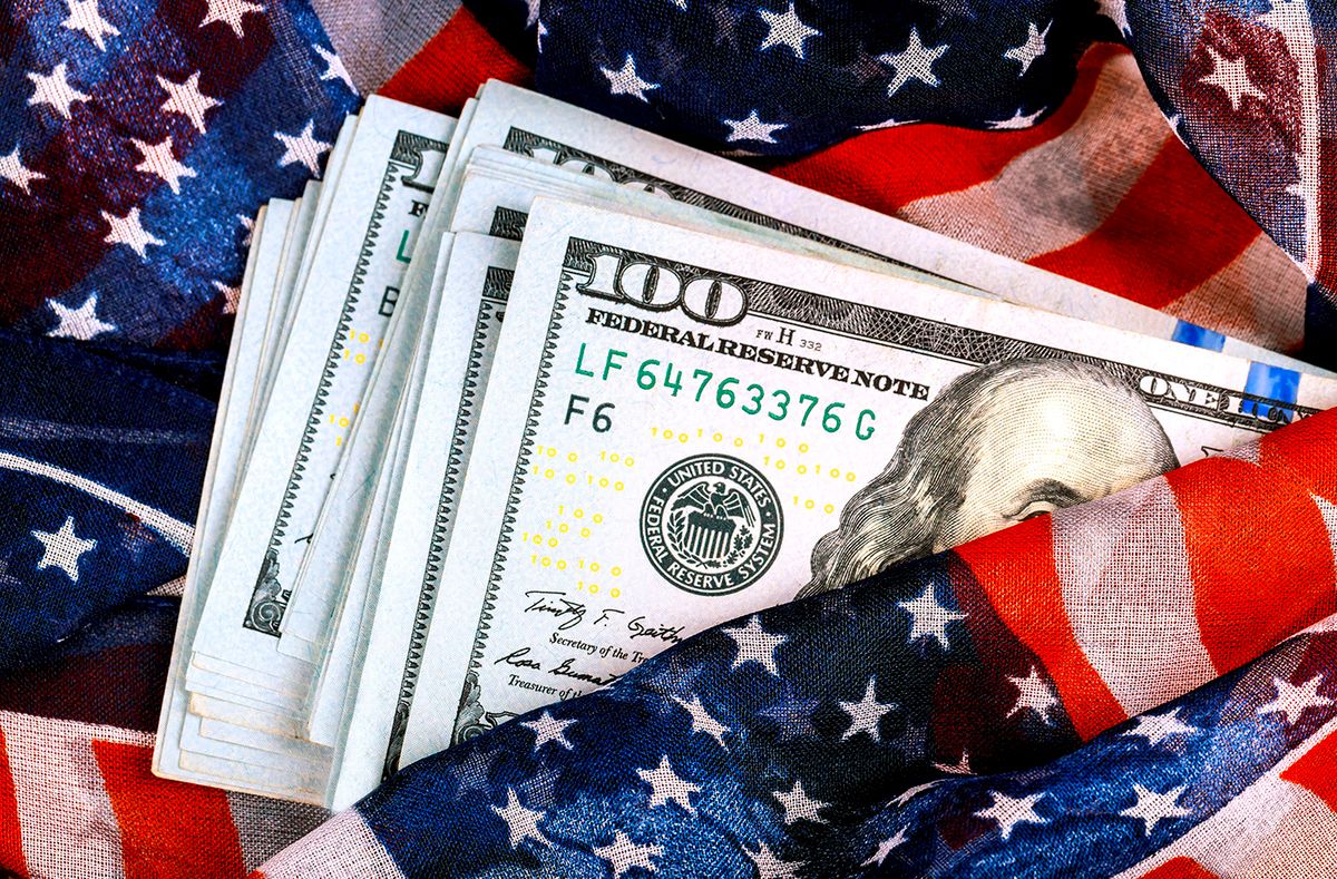 Close-Up On Textile And Currencies
Banknotes US Currency with an American flag background.