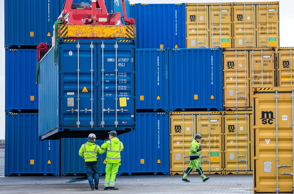 Container traffic on new Silk Road 11 February 2022, Mecklenburg-Western Pomerania, Mukran: A container is unloaded at the port of Mukran after the arrival of the first ship of a new "Silk Road" connection between China and Germany. The containers from Wuhan in China cover part of the route by water and are loaded back onto rail cars on the island of Rügen. Photo: Jens Büttner/dpa-Zentralbild/dpa (Photo by Jens Büttner/picture alliance via Getty Images)