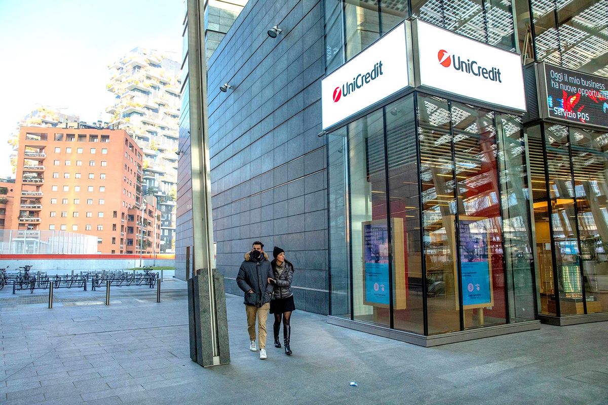 Unicredit SpA Ahead of Earnings Pedestrians pass by a UniCredit SpA bank branch in Milan, Italy, on Saturday Jan. 22, 2022. Starting Thursday, the regions top lenders are set to report their highest annual trading and capital markets revenues in seven years and an almost halving of their bad loan provisions in the final quarter of the 2021 from a year earlier. Photographer: Francesca Volpi/Bloomberg via Getty Images